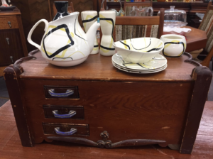 Some Hip Red Wing MCM Service Ware Atop A Antique Sewing Box at Ambridge Antiques (Available for film rentals or purchase) Iroquois Falls, ON